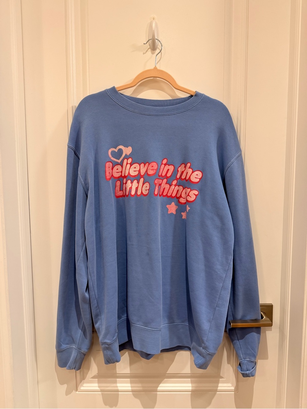 Light Blue Crewneck Sweatshirt with Pink Puff Graphic